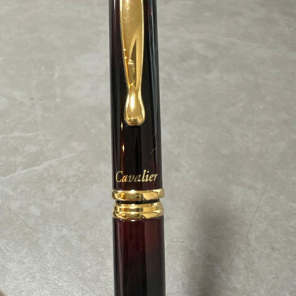 Pilot Cavalier fountain pen in dark brown with gold trim and capped nib on white background