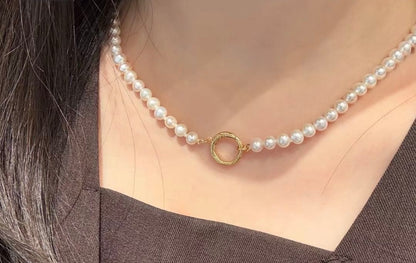 Agete pearl necklace featuring lustrous freshwater pearls displayed with gift box and guarantee card