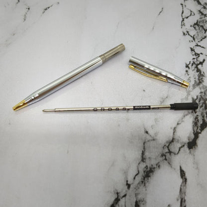 Law Cross Classic Century Medalist ballpoint pen in silver and gold with black ink and twist mechanism displayed with gift box