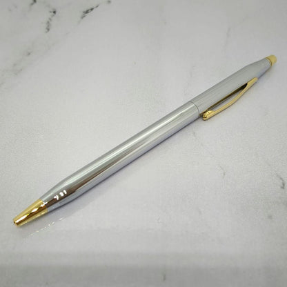 Law Cross Classic Century Medalist ballpoint pen in silver and gold with black ink and twist mechanism displayed with gift box