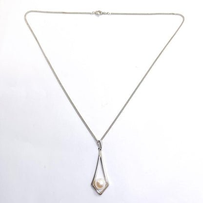 MIKIMOTO silver necklace pendant featuring a 7mm pearl on a 43cm chain weighing 4.6 grams