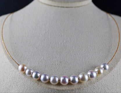 Akoya pearl necklace with 11 round pearls sized 7.5-8.5mm in white pink, gray, and champagne gold on K18 omega chain