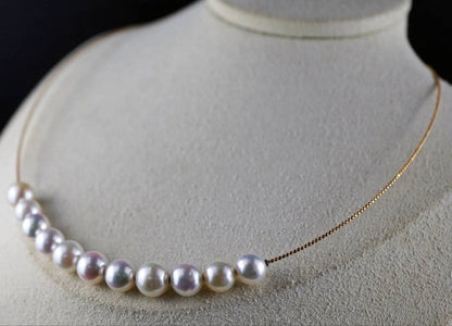 Akoya pearl necklace with 11 round pearls sized 7.5-8.5mm in white pink, gray, and champagne gold on K18 omega chain