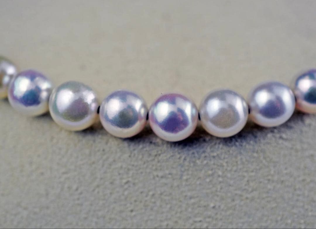Akoya pearl necklace with 11 round pearls sized 7.5-8.5mm in white pink, gray, and champagne gold on K18 omega chain