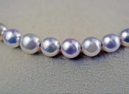 Akoya pearl necklace with 11 round pearls sized 7.5-8.5mm in white pink, gray, and champagne gold on K18 omega chain