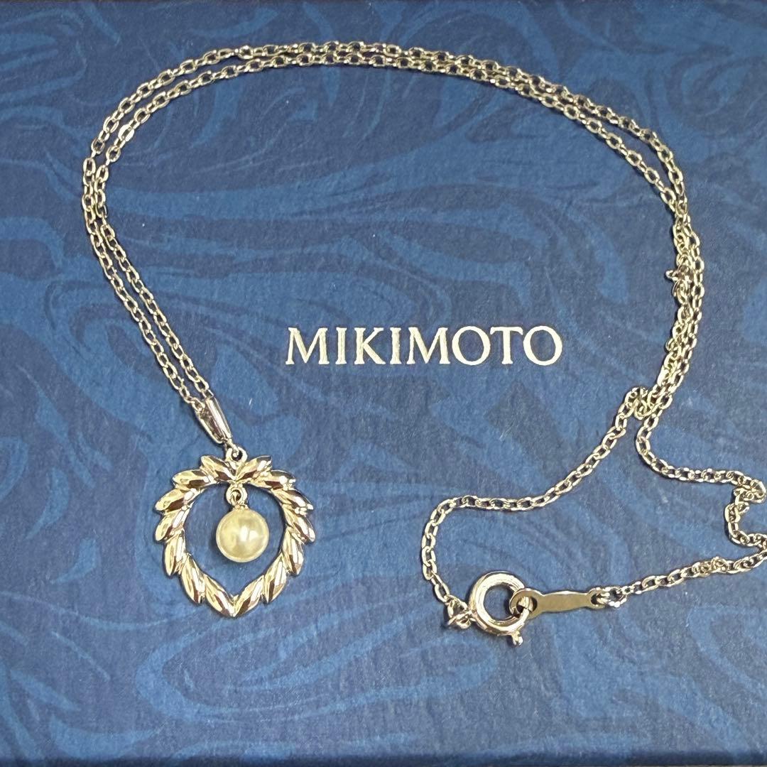 Mikimoto silver pearl necklace with 37.5 cm length displayed on white background