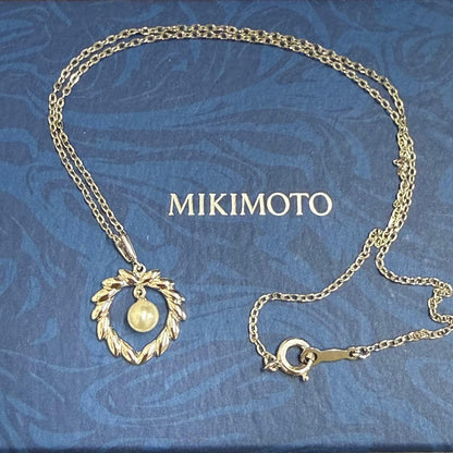 Mikimoto silver pearl necklace with 37.5 cm length displayed on white background