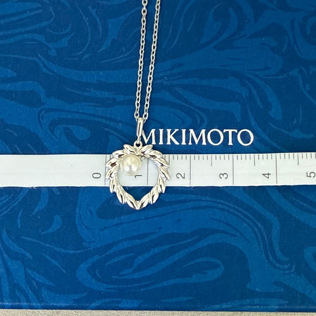 Mikimoto silver pearl necklace with 37.5 cm length displayed on white background