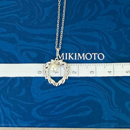 Mikimoto silver pearl necklace with 37.5 cm length displayed on white background