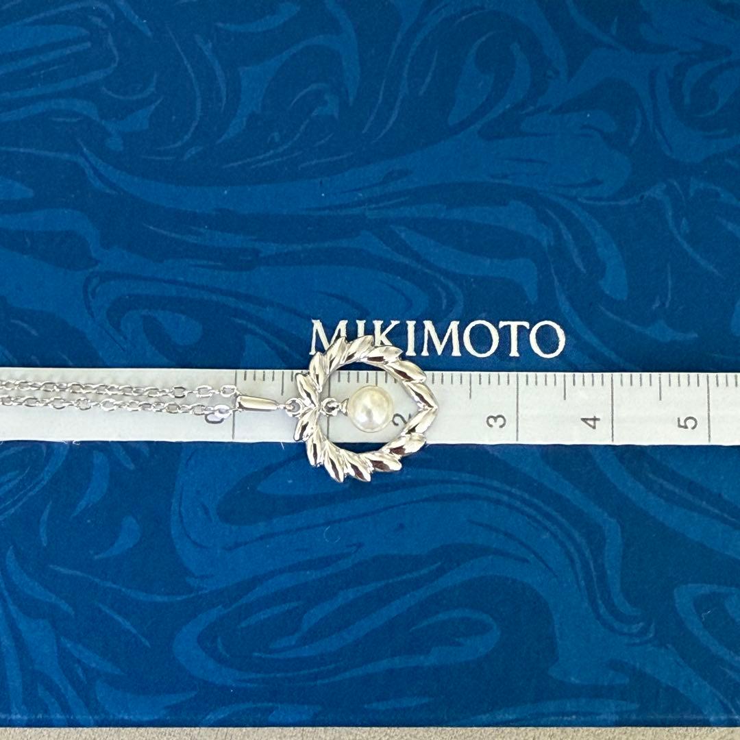 Mikimoto silver pearl necklace with 37.5 cm length displayed on white background