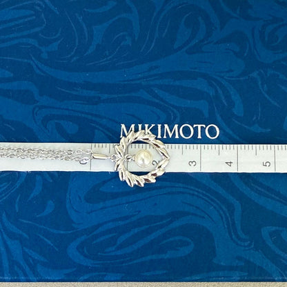 Mikimoto silver pearl necklace with 37.5 cm length displayed on white background