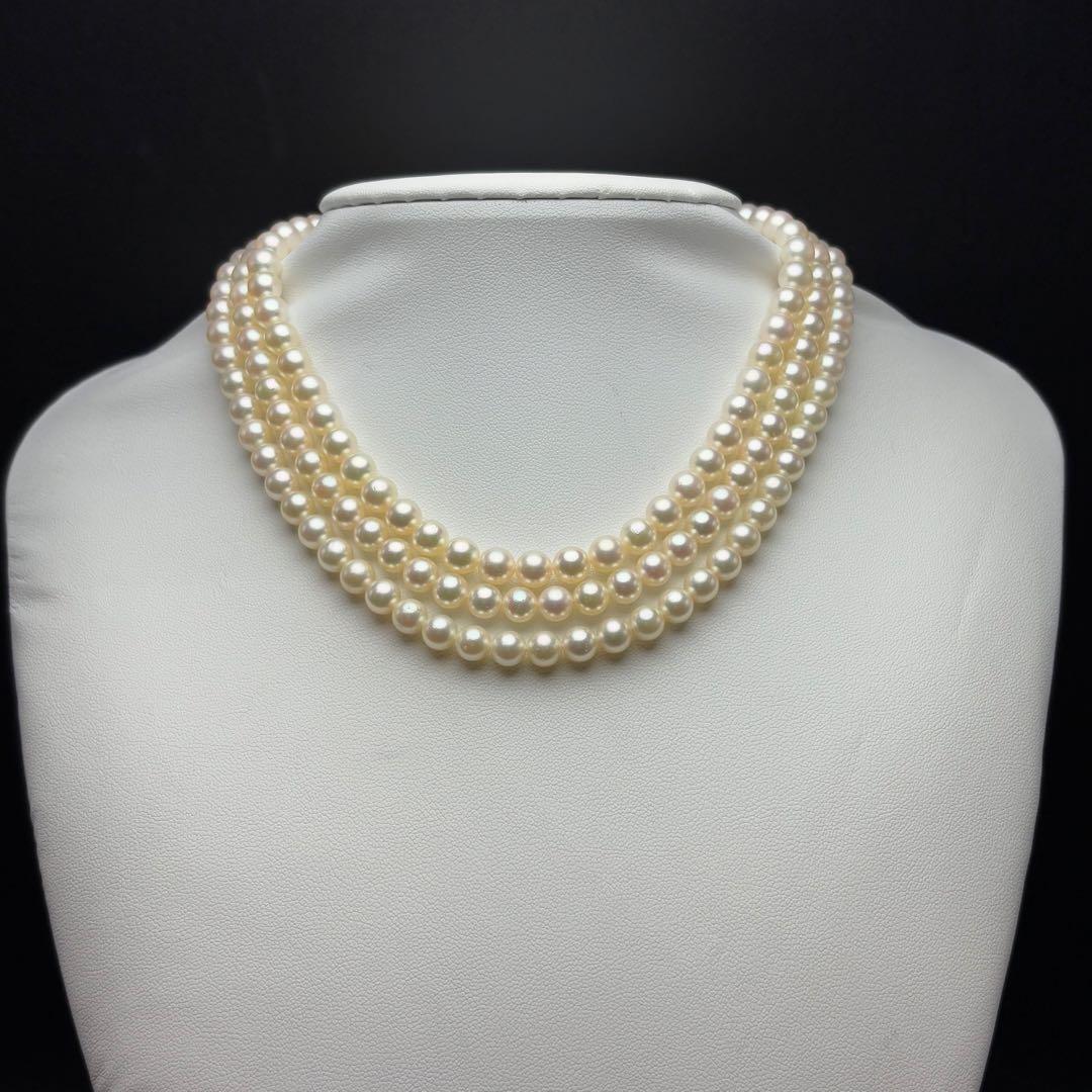 MIKIMOTO Akoya pearl necklace with 6.0-6.5mm white pearls and silver clasp on white background