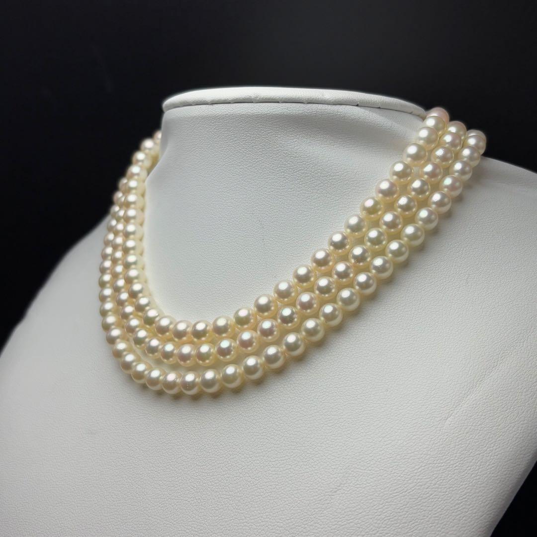 MIKIMOTO Akoya pearl necklace with 6.0-6.5mm white pearls and silver clasp on white background
