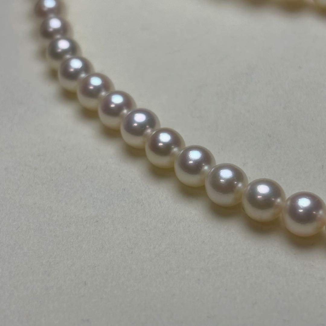 MIKIMOTO Akoya pearl necklace with 6.0-6.5mm white pearls and silver clasp on white background