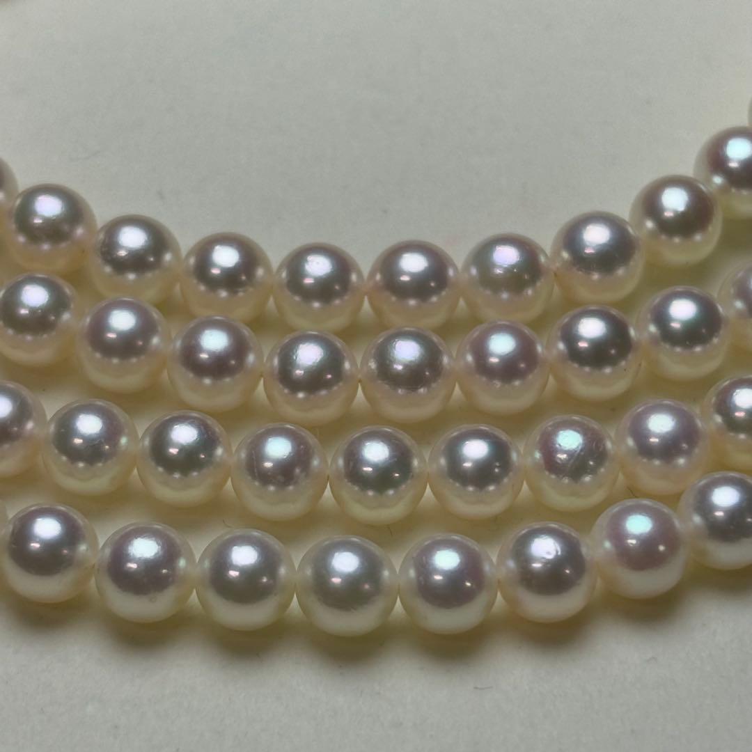 MIKIMOTO Akoya pearl necklace with 6.0-6.5mm white pearls and silver clasp on white background