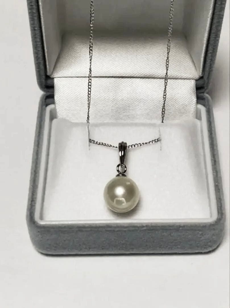 White Akoya Pearl Pendant Top featuring a 9.4mm white pearl with silver pendant banger and hallmark