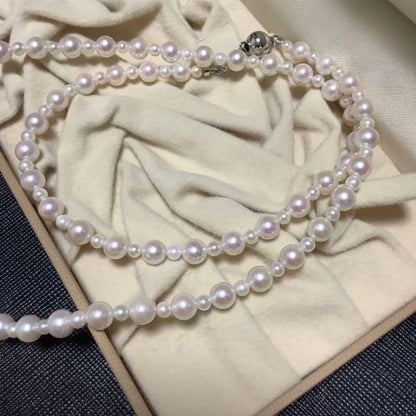 60 centimeter Akoya pearl necklace with pink tone pearls and silver hook closure