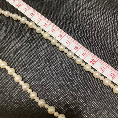 60 centimeter Akoya pearl necklace with pink tone pearls and silver hook closure