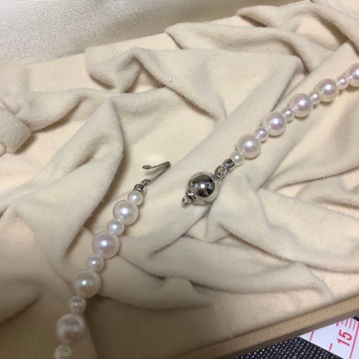 60 centimeter Akoya pearl necklace with pink tone pearls and silver hook closure