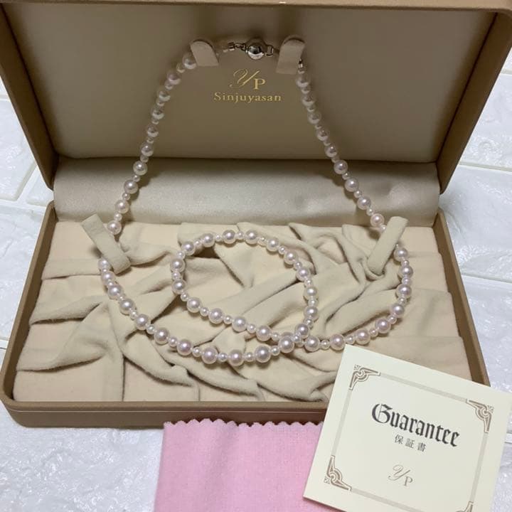 60 centimeter Akoya pearl necklace with pink tone pearls and silver hook closure