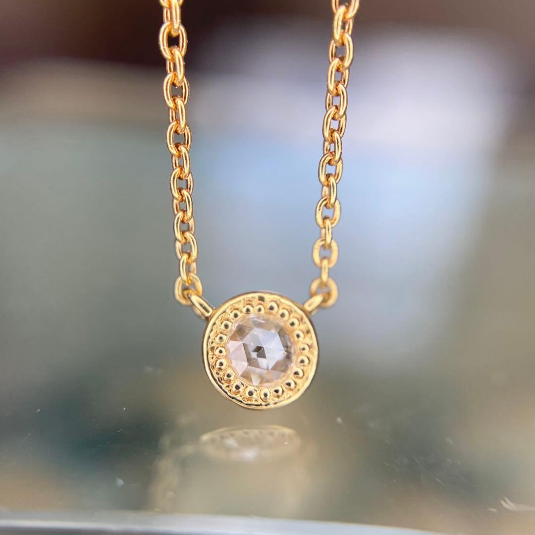 AGETE K18 yellow gold necklace with 0.03 ct rose cut diamond and milgrain detailing on a delicate chain