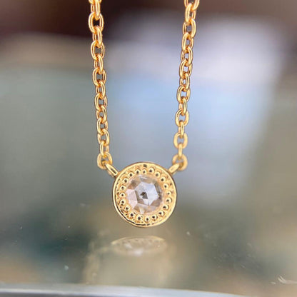 AGETE K18 yellow gold necklace with 0.03 ct rose cut diamond and milgrain detailing on a delicate chain