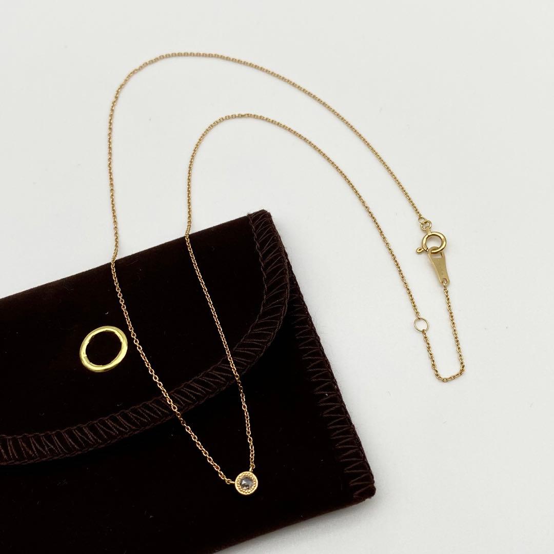 AGETE K18 yellow gold necklace with 0.03 ct rose cut diamond and milgrain detailing on a delicate chain