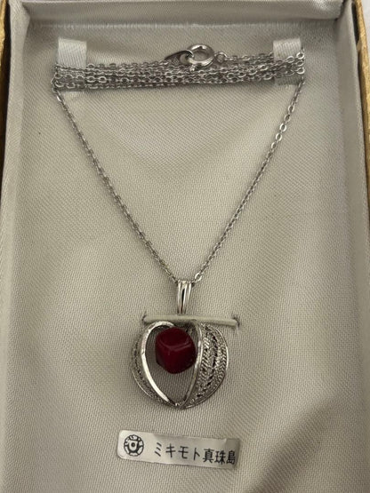 Mikimoto Takase shell necklace and brooch set in new and unopened condition