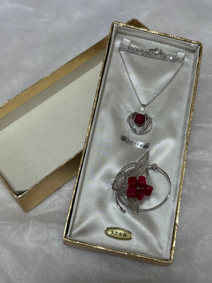 Mikimoto Takase shell necklace and brooch set in new and unopened condition
