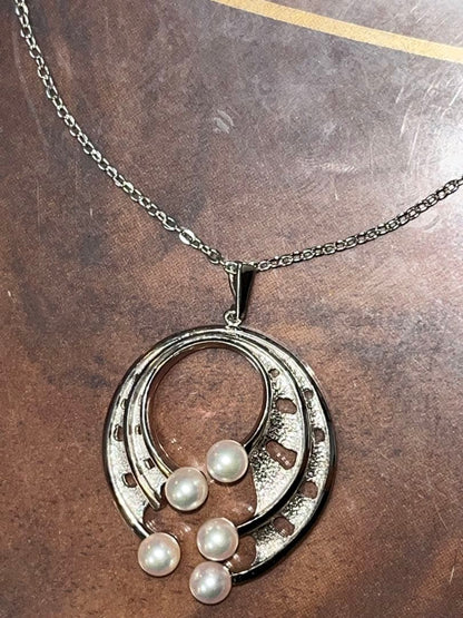Tasaki large geometry necklace with 3.8cm pendant and 6.5mm Akoya pearl on 77cm chain