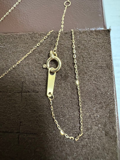 Agete K10 gold necklace with tapered baguette cut diamonds, 39cm length, and delicate pendant