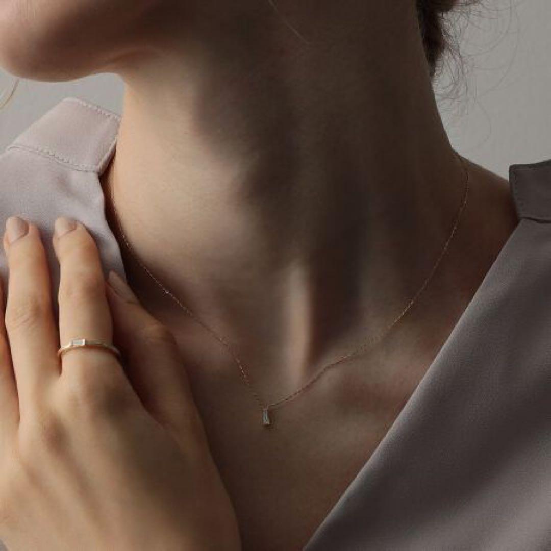 Agete K10 gold necklace with tapered baguette cut diamonds, 39cm length, and delicate pendant