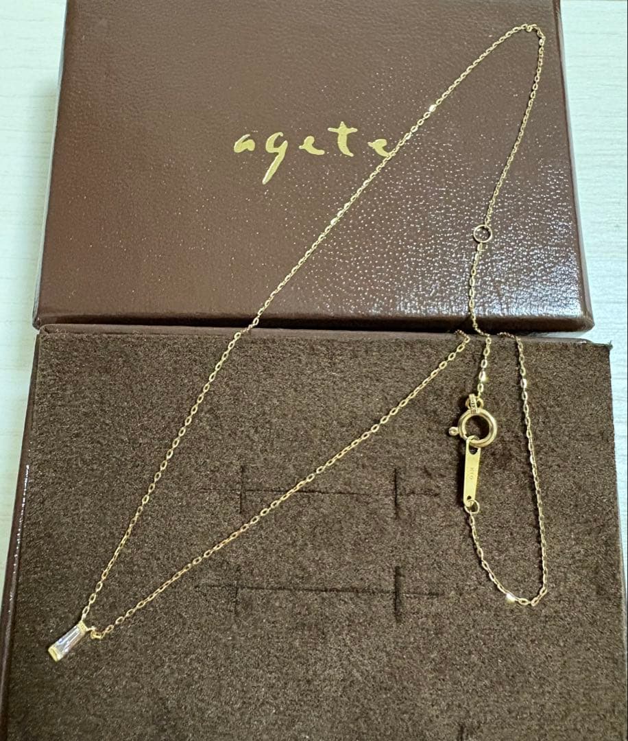 Agete K10 gold necklace with tapered baguette cut diamonds, 39cm length, and delicate pendant