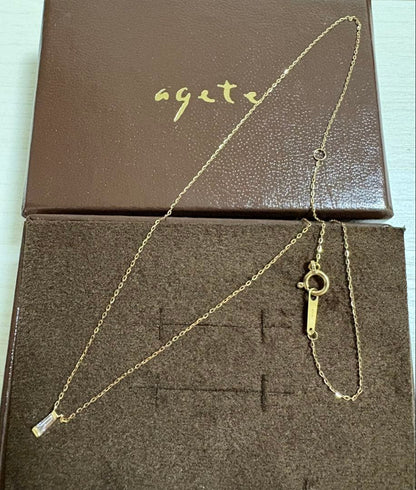 Agete K10 gold necklace with tapered baguette cut diamonds, 39cm length, and delicate pendant