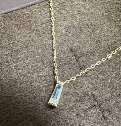 Agete K10 gold necklace with tapered baguette cut diamonds, 39cm length, and delicate pendant