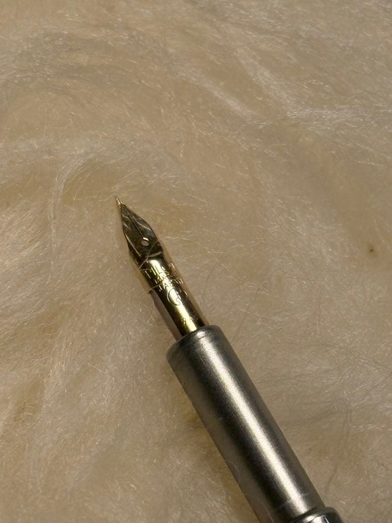 Unused Pilot Capless Fountain Pen with 14K fine nib shown uncapped on white background