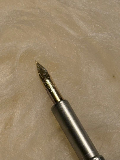 Unused Pilot Capless Fountain Pen with 14K fine nib shown uncapped on white background