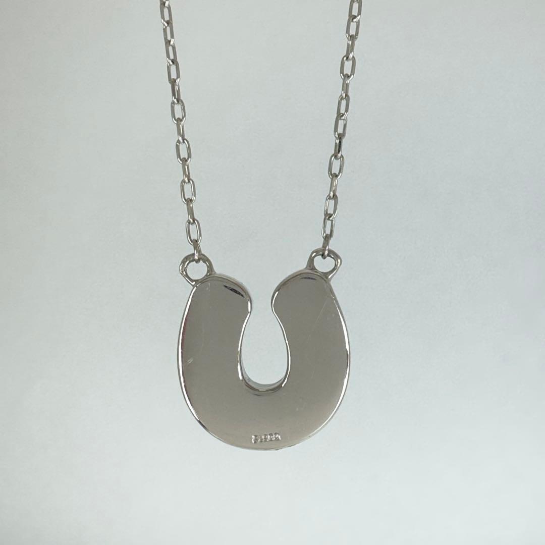 PT900 Akoya Pearl Horseshoe Pendant featuring 8 pearls on a PT850 chain with slide clasp