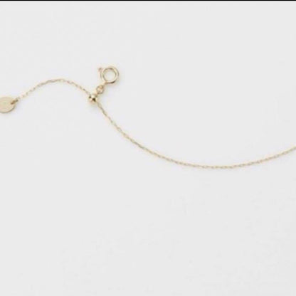 Agete K10 gold necklace adjuster chain measuring 10.5 cm length on a white background