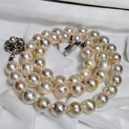 Abyssal Akoya Pearl Necklace in silver with 8.4 mm pearls on a white background