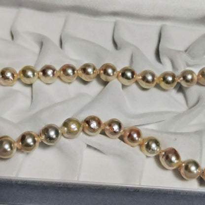 Abyssal Akoya Pearl Necklace in silver with 8.4 mm pearls on a white background