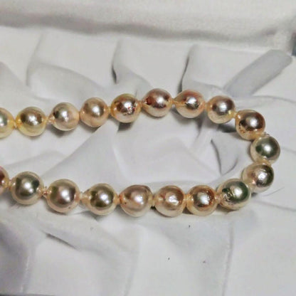 Abyssal Akoya Pearl Necklace in silver with 8.4 mm pearls on a white background