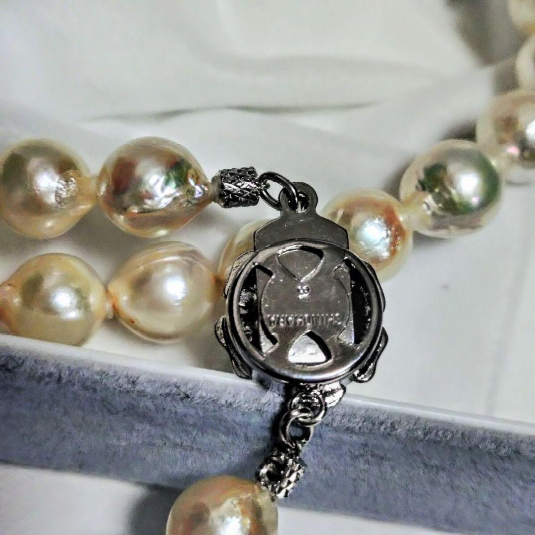 Abyssal Akoya Pearl Necklace in silver with 8.4 mm pearls on a white background
