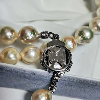 Abyssal Akoya Pearl Necklace in silver with 8.4 mm pearls on a white background