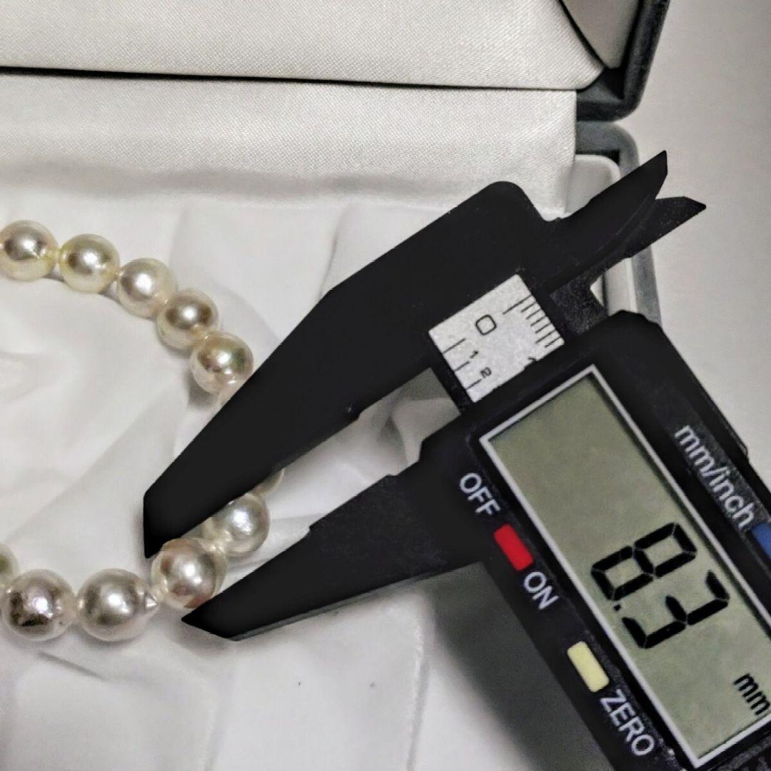 Abyssal Akoya Pearl Necklace in silver with 8.4 mm pearls on a white background