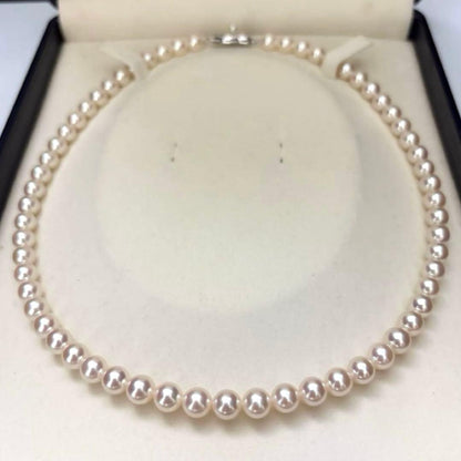 Hanadama Aurora Interference color Akoya pearl necklace in pink white with round 7mm pearls and silver stamp logo