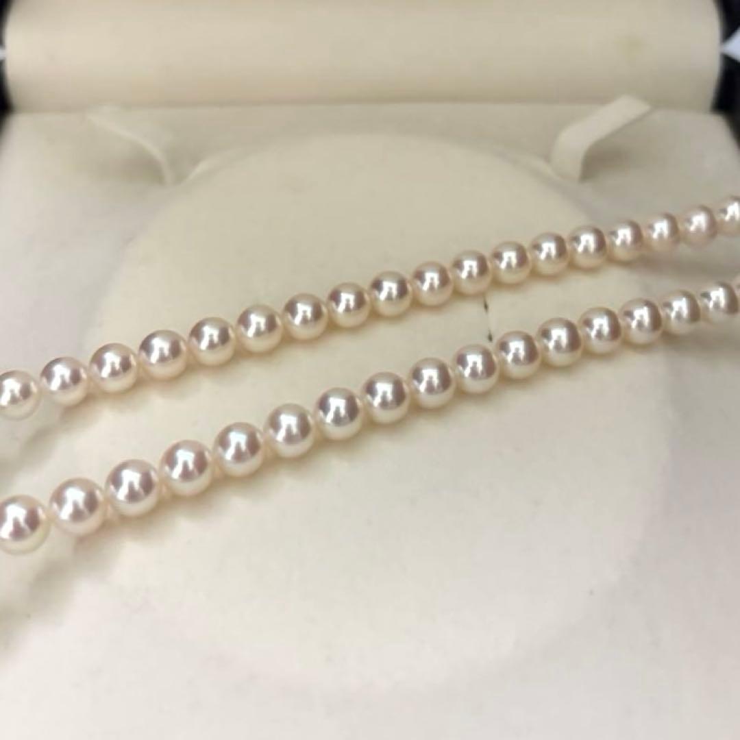 Hanadama Aurora Interference color Akoya pearl necklace in pink white with round 7mm pearls and silver stamp logo
