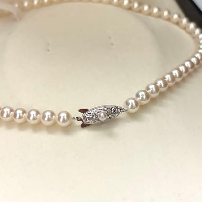 Hanadama Aurora Interference color Akoya pearl necklace in pink white with round 7mm pearls and silver stamp logo