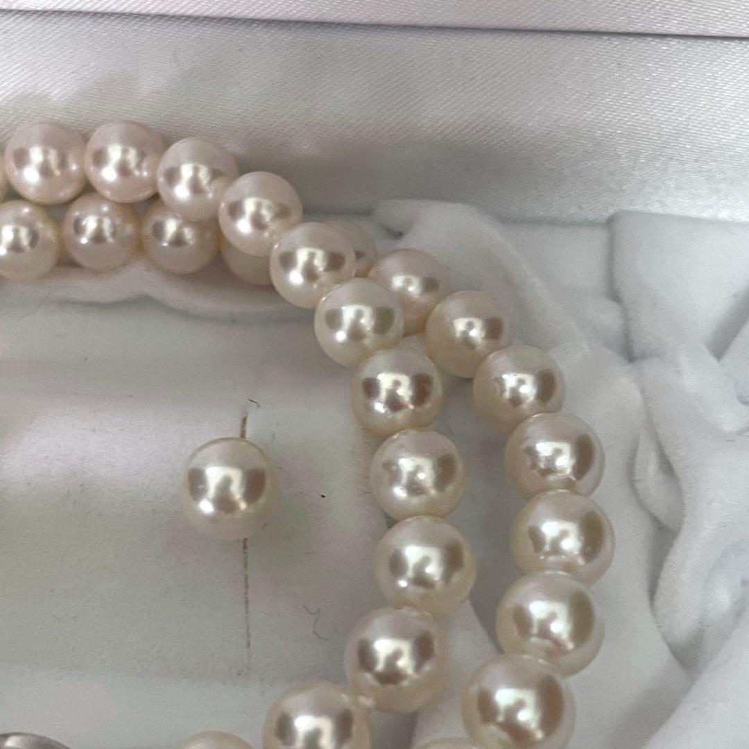 Large Akoya pearl earrings and matching necklace set with 7.5-8mm pearls in a jewelry box