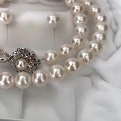 Large Akoya pearl earrings and matching necklace set with 7.5-8mm pearls in a jewelry box